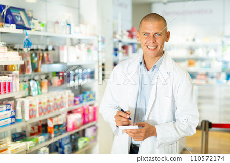 Male pharmacist in drugstore Male pharmacist in drugstore 110572174
