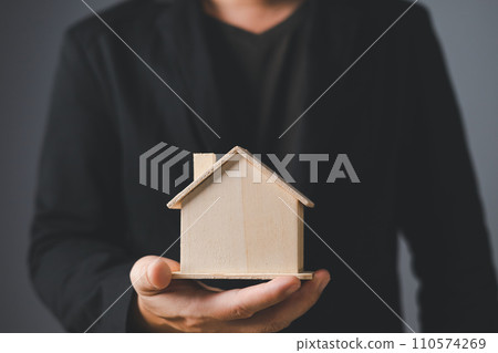 the businessman holding a piggy bank, donation, charity, fundraising, superannuation, investment, saving, family finance plan concept, Money Saving Ideas for Buying a Home. 110574269