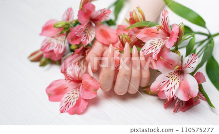 Elegant pastel pink natural manicure. Elegant pastel pink natural manicure. 110575277