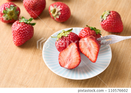 Strawberries cut in half Strawberries cut in half 110576602