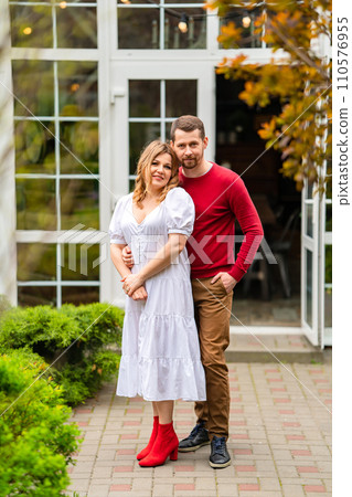 A man and a woman in the courtyard of a country house. A man and a woman in the courtyard of a country house. 110576955