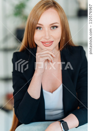portrait of a Beautiful businesswoman in black business suit. portrait of a Beautiful businesswoman in black business suit. 110576967