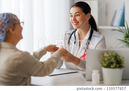 Female patient listening to doctor 110577857