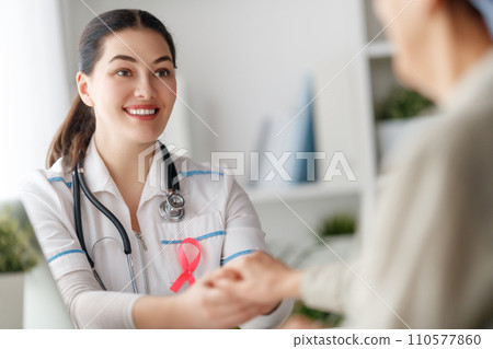 Female patient listening to doctor 110577860