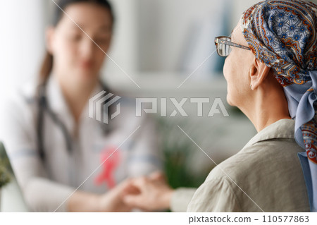 Female patient listening to doctor 110577863