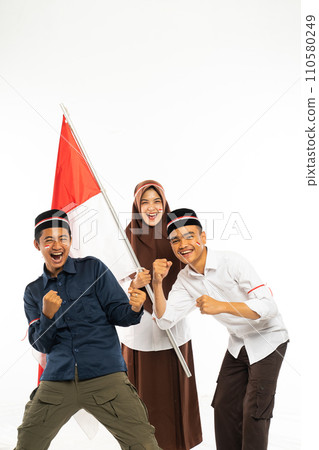 three islamic students standing clenched their arm 110580249