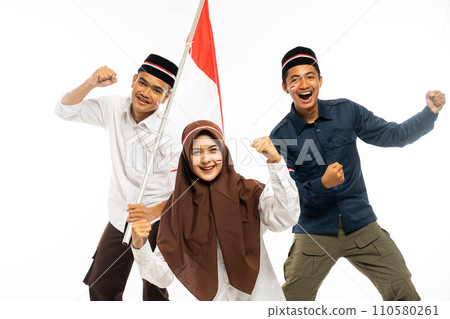 three islamic student standing together and clenched their arm with spirit three islamic student standing together and clenched their arm with spirit 110580261