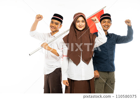 three islamic students standing clenched their arm three islamic students standing clenched their arm 110580375