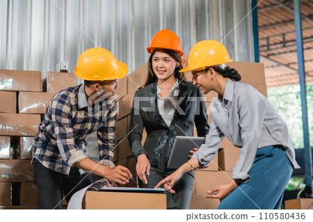 supervisors and factory staff meeting before checking goods in the factory warehouse supervisors and factory staff meeting before checking goods in the factory warehouse 110580436