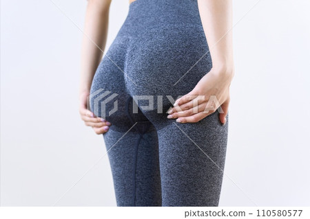 A woman suffering from sagging buttocks A woman suffering from sagging buttocks 110580577