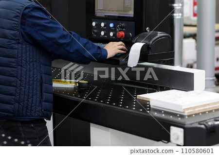 factory worker labeling barcode shipping stickers factory worker labeling barcode shipping stickers 110580601