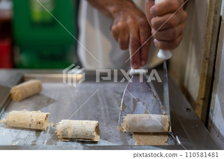 Crafting Rolled Ice Cream Delight on a Hot Metal Plate Crafting Rolled Ice Cream Delight on a Hot Metal Plate 110581481