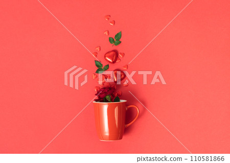 Valentine's day concept. Red cup with roses, chocolate and red hearts on red background Valentine's day concept. Red cup with roses, chocolate and red hearts on red background 110581866