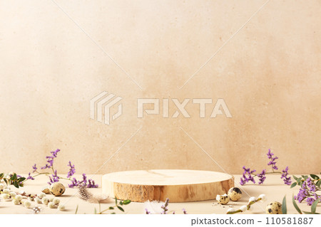 Empty round wooden podium, quail eggs with spring flowers on a beige background. Front view Empty round wooden podium, quail eggs with spring flowers on a beige background. Front view 110581887