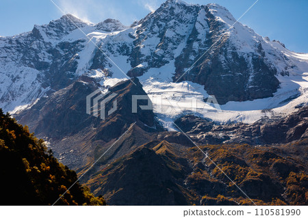 Snow-capped mountains rise majestically along the horizon Snow-capped mountains rise majestically along the horizon 110581990