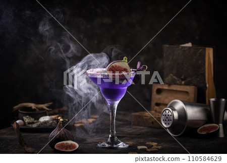 Purple fig cocktail or mocktail in glass Purple fig cocktail or mocktail in glass 110584629