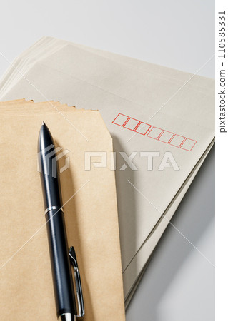 Envelopes and pen 110585331
