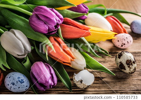 Colorful tulips on old wooden background 110585733