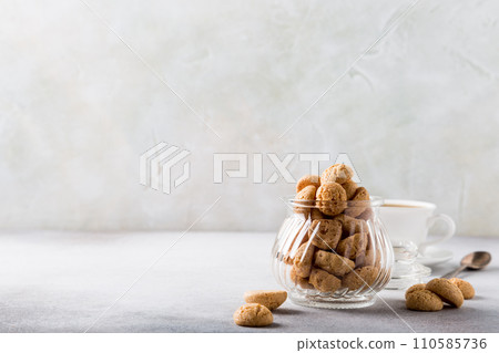 Amaretti cookies with white cup of coffee 110585736