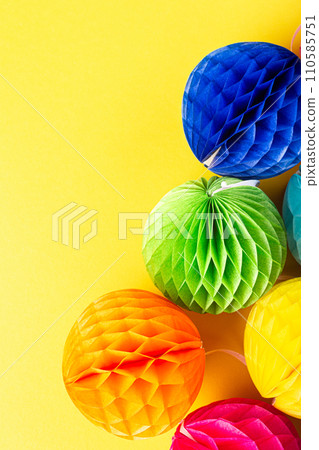 Festive background with colorful paper balls. 110585751