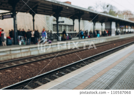 Blurred people at a railway station traveling by train. Travel Concept 110587068