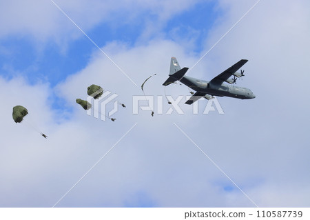 Ranger descending from a transport plane, airborne drop, parachute training, special forces 110587739