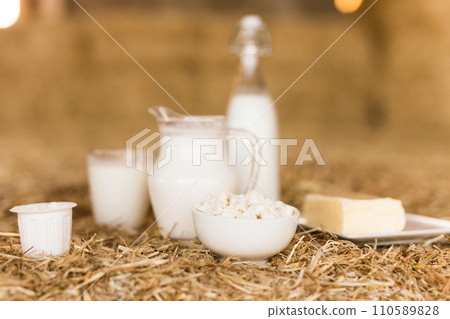 Dairy products on table against the background of hay 110589828