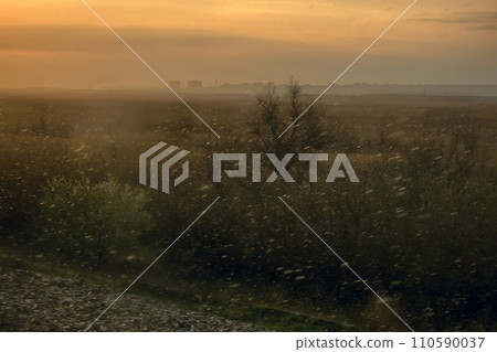 Journey in car in rainy day. Outside window snow 110590037