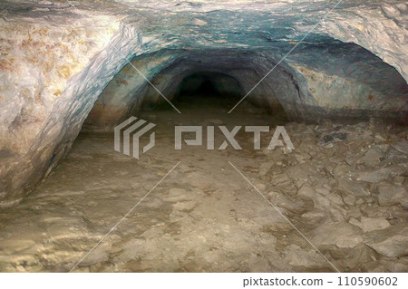 dark cave walk under ground in tunnel dark cave walk under ground in tunnel 110590602