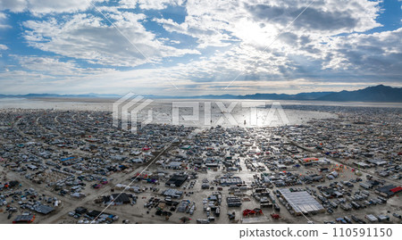 People camping in a desert during a heavy storm. Aerial shot of the camp city from above. People camping in a desert during a heavy storm. Aerial shot of the camp city from above. 110591150