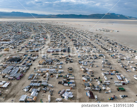 People camping in a desert during a heavy storm. Aerial shot of the camp city from above. People camping in a desert during a heavy storm. Aerial shot of the camp city from above. 110591180