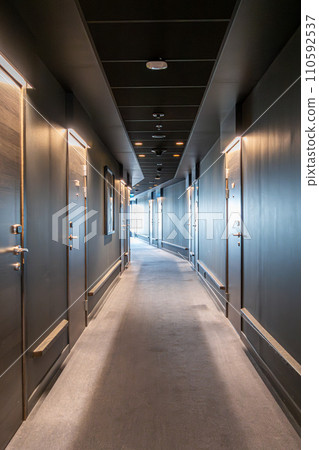 Image of Long dark corridor in a luxury hotel 110592537