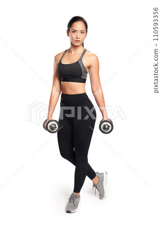 an asian woman is working out with dumbbells wearing the sport exercise suit with white background, an asian woman is working out with dumbbells wearing the sport exercise suit with white background, 110593356