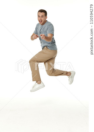 happy guy looking pointing at the camera on white studio background happy guy looking pointing at the camera on white studio background 110594279