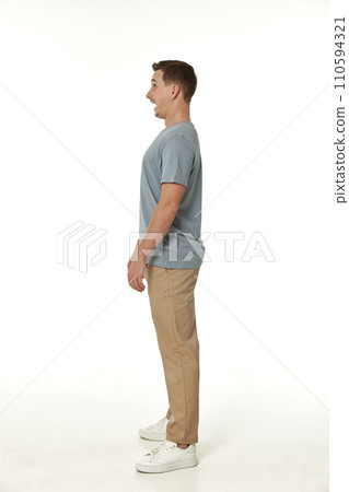 surprised guy looking at camera on white studio background 110594321