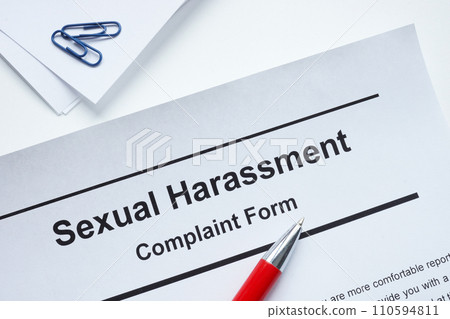 Sexual harassment compliant form and pen for filling out. Sexual harassment compliant form and pen for filling out. 110594811