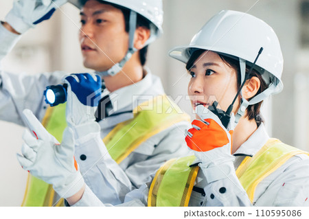 Workers using transceivers at construction sites Workers using transceivers at construction sites 110595086