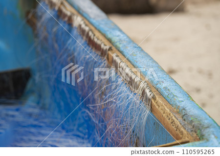 Nice view of hundreds of fishing hooks attached to the wooden boat Nice view of hundreds of fishing hooks attached to the wooden boat 110595265