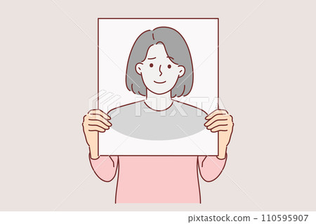 Anonymous woman hides face behind banner with fake portrait to remain incognito and leave no traces Anonymous woman hides face behind banner with fake portrait to remain incognito and leave no traces 110595907