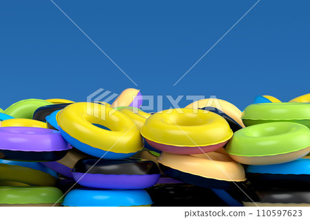 Pile of inflatable ring for swimming pool isolated on blue background 110597623