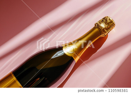 Champagne bottle on pastel background. Party background with sparkling wine, celebration. Creative flat lay, top view with copy space. Bachelorette, hen night, birthday or wedding concept Champagne bottle on pastel background. Party background with sparkling wine, celebration. Creative flat lay, top view with copy space. Bachelorette, hen night, birthday or wedding concept 110598381