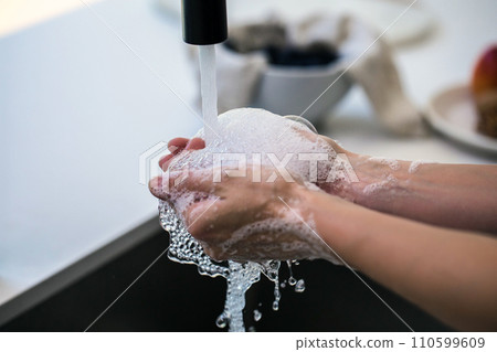 Hands wash procedure, cleaning hands with soap from viruses and contamination. Wash hands before dinner Hands wash procedure, cleaning hands with soap from viruses and contamination. Wash hands before dinner 110599609