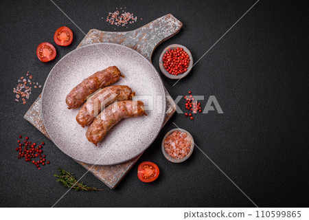 Delicious juicy grilled chicken or pork sausages with salt, spices and herbs 110599865