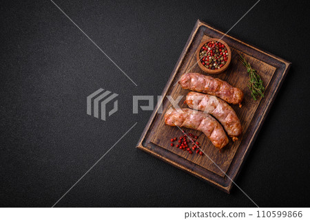 Delicious juicy grilled chicken or pork sausages with salt, spices and herbs 110599866