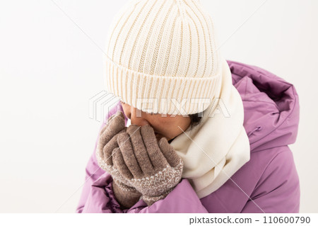 Middle-aged woman wearing winter clothes Middle-aged woman wearing winter clothes 110600790