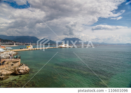Beautiful sandy beach and soft turqoise Mediterranean sea wave - Landscape of ancient shipyard near of Kizil Kule tower - Alanya peninsula, Turkey 110601096