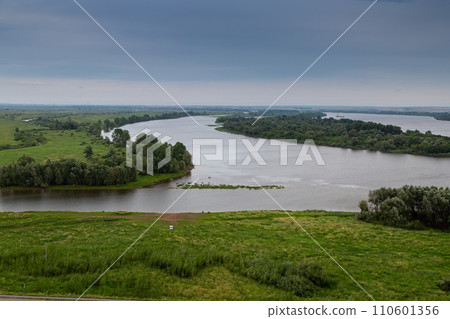 View of Kama River. Mouth of Toima River. Toyma flows into Kama near town Yelabuga, Russia. Summer natural landscape View of Kama River. Mouth of Toima River. Toyma flows into Kama near town Yelabuga, Russia. Summer natural landscape 110601356