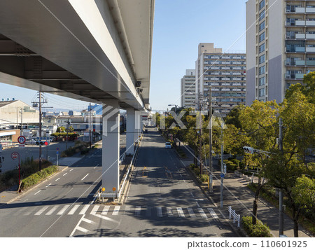 Elevated city road Hamaguchi Nanko Line and New Tram running through Osaka city Elevated city road Hamaguchi Nanko Line and New Tram running through Osaka city 110601925