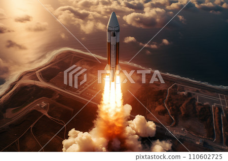Aerial view of rocket launch at sunrise over ocean coast 110602725