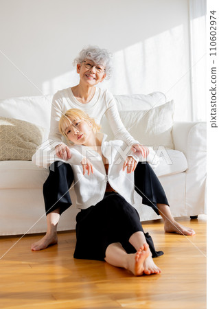 Family portrait of young woman and senior woman Family portrait of young woman and senior woman 110602974